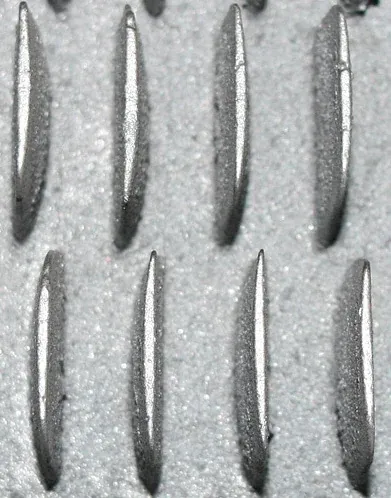 Detail of a finned plate with concave and convex fins
